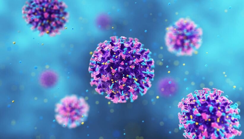 Colorful coronavirus–like particles floating in a blue background, showing spike proteins on purple bodies.
