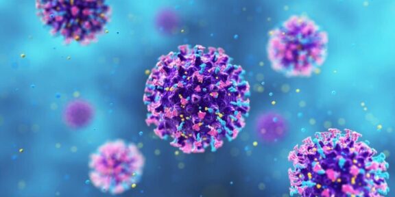 Colorful coronavirus–like particles floating in a blue background, showing spike proteins on purple bodies.