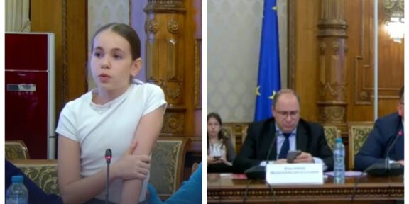 Woman speaking into a microphone at a formal meeting, ornate wood paneling behind her (left).