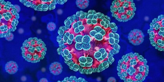 Colorful 3D rendering of multiple coronavirus particles with blue spike proteins on pink-red cores in a dark blue background.